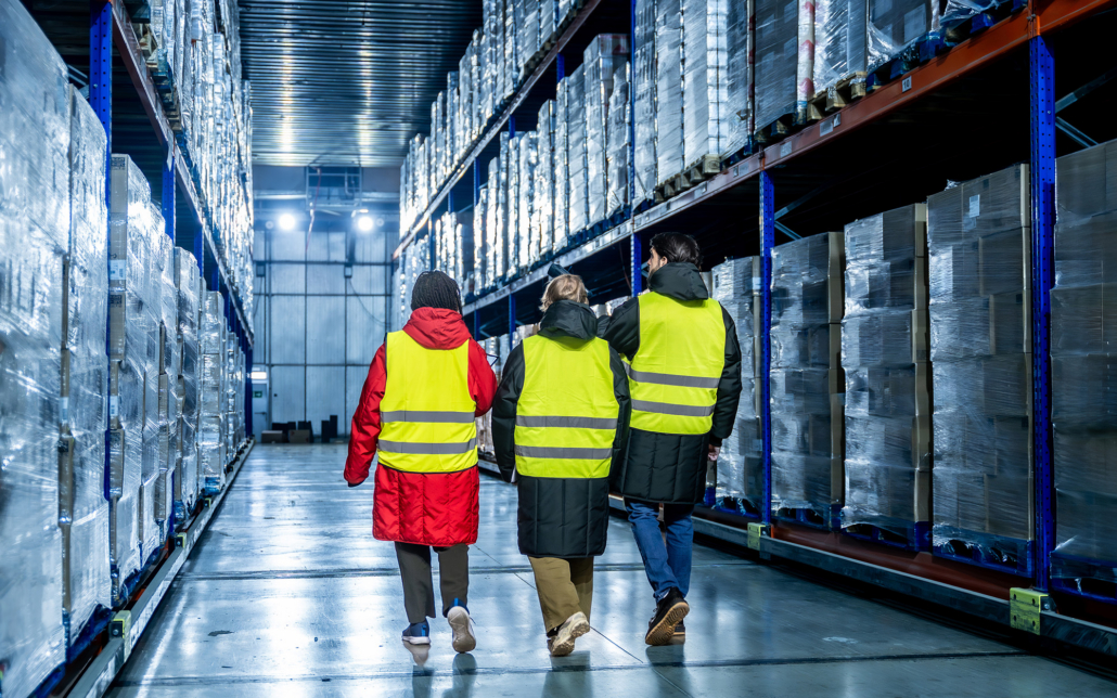 Workers Walking In Cold Storage